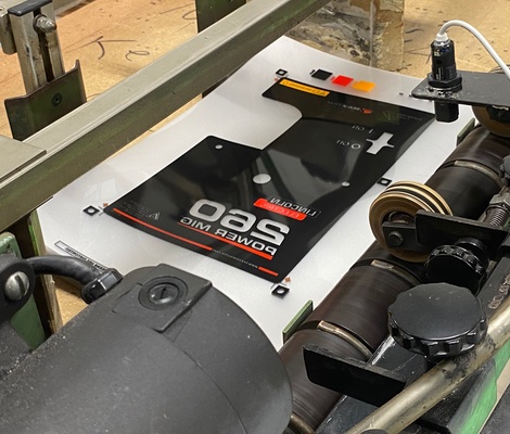 press printing a graphic overlay