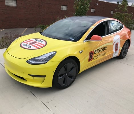 car with Biggby Coffee wrap